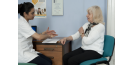 Female osteopath with elderly woman 4