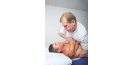 Male osteopath with male back