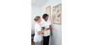 Osteopath and student with chart