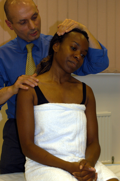 Male osteopath with female - neck