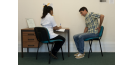 Female osteopath with young man 2