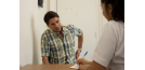 Female osteopath with young man