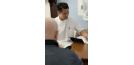 Male osteopath writing sick note