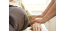 Osteopath and woman - arms