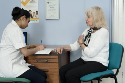 Female osteopath with elderly woman 5