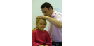 Male osteopath with female child