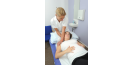 Female osteopath treating pregnant female