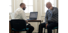 Osteopath and middle-aged man consultation
