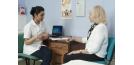 Female osteopath with elderly woman 2