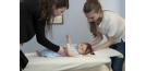 Female osteopath treating baby 2