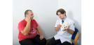 Male osteopath with male patient - skull