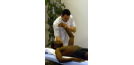 Male osteopath with male patient