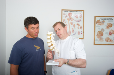 Osteopath and patient discussing treatment