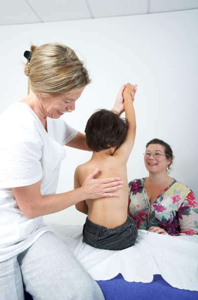 Female osteopath and boy 3