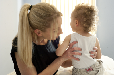 Female osteopath treating toddler 3