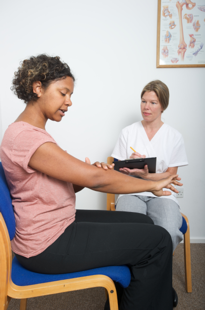 Female osteopath with female patient