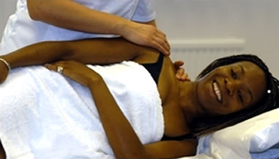 Male osteopath with female patient