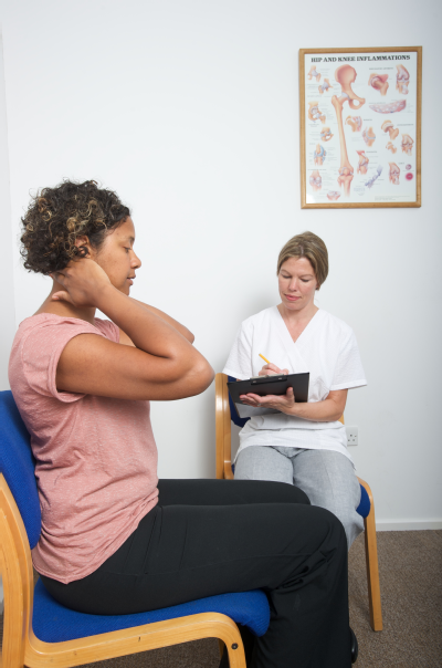 Female osteopath with female patient