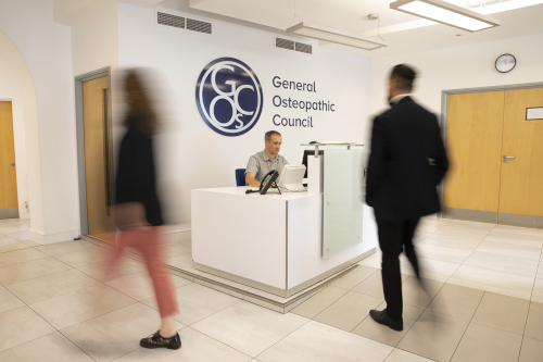 Visitors at the reception desk of Osteopathy House