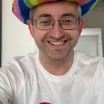 A selfie of Matthew Redford, GOsC Chief Executive and Registrar in a rainbow cowboy hat and GOsC Pride tshirt