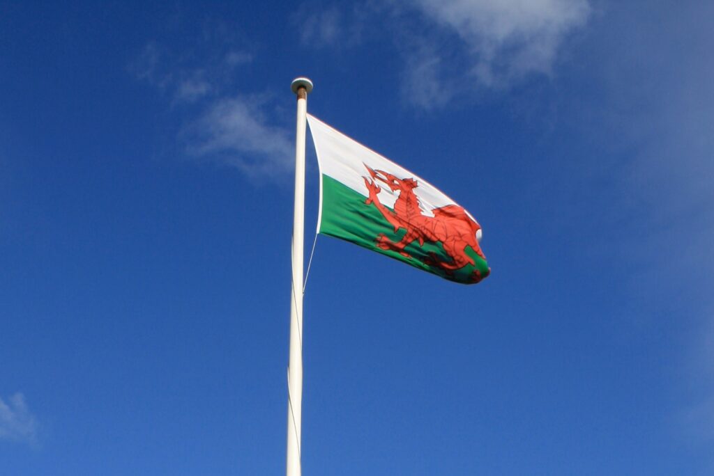 Welsh flag against a blue sky
